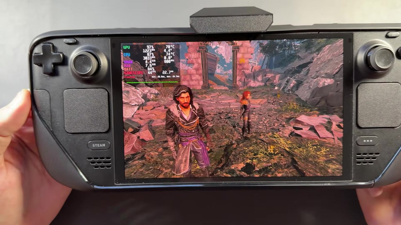 Steam Deck OLED in the JSAUX ModCase with the cooling fan attached, running Expedition 33