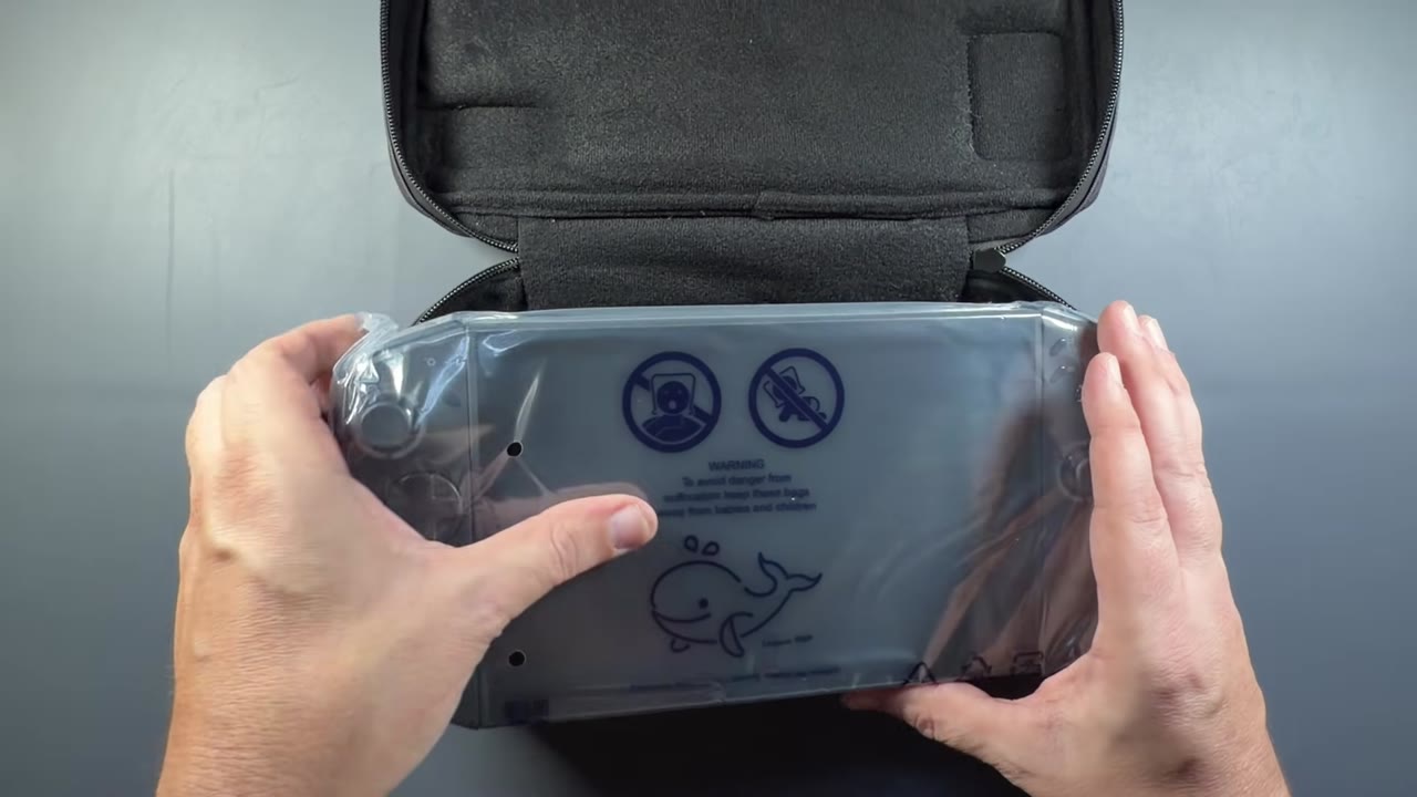 The Legion Go 2 coming out of its included soft carrying case