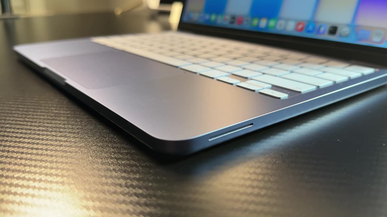 Apple MacBook Neo close-up of the keyboard deck and edge