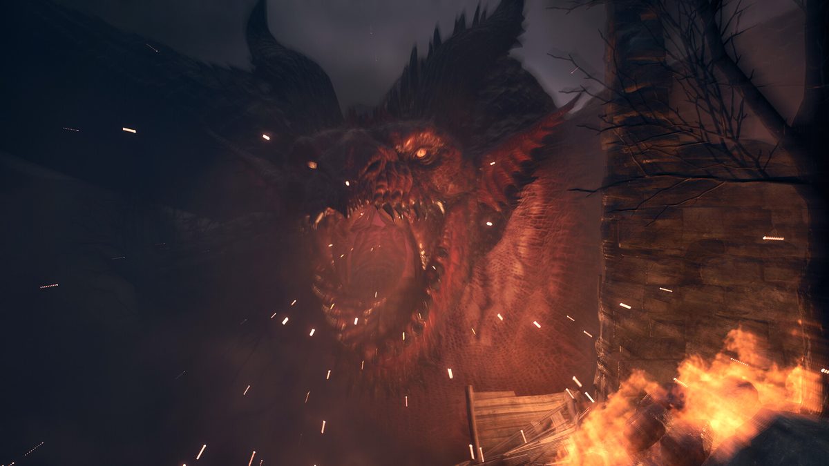 Dragon's Dogma 2 screenshot of a red dragon roaring beside a burning tower
