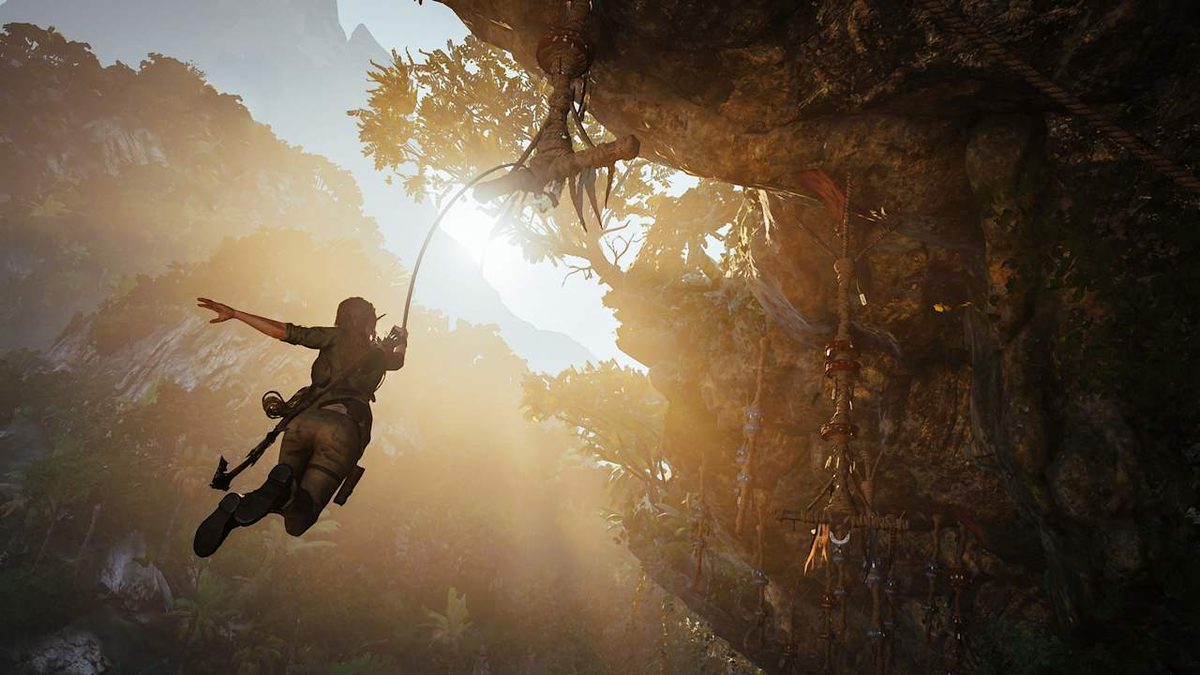 Lara Croft swinging on a rope through a sunlit jungle