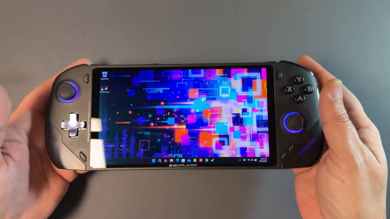 OneXFly F1 Pro held in hand showing its 7-inch OLED screen