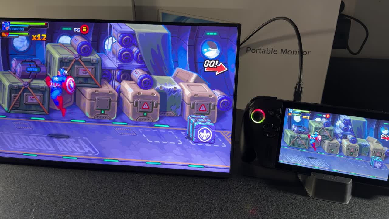 ROG Xbox Ally X next to the UPerfect 4K QLED monitor showing the same game on both screens