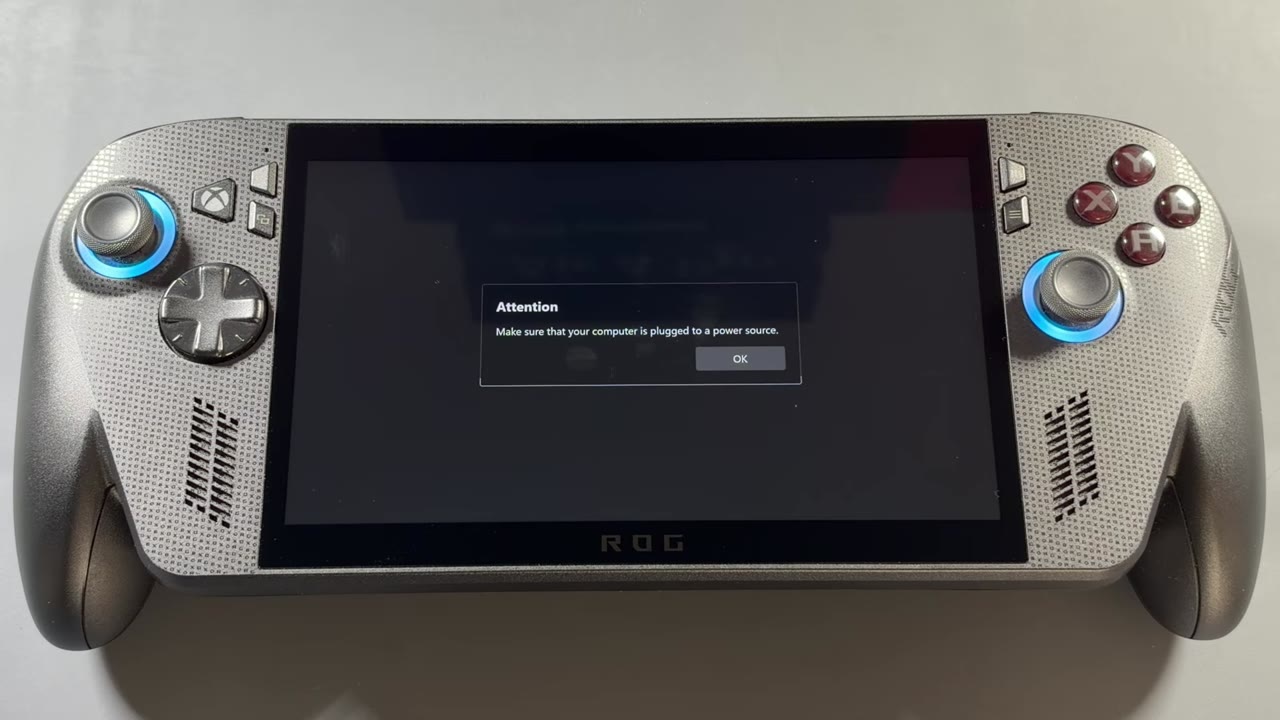 Armoury Crate SE Attention prompt on the ROG Xbox Ally X asking to plug into a power source